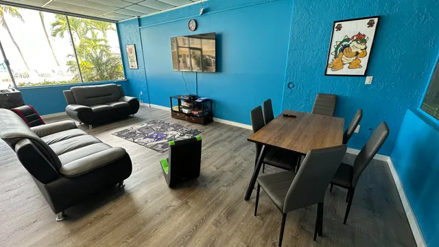 a dining room with furniture and a window