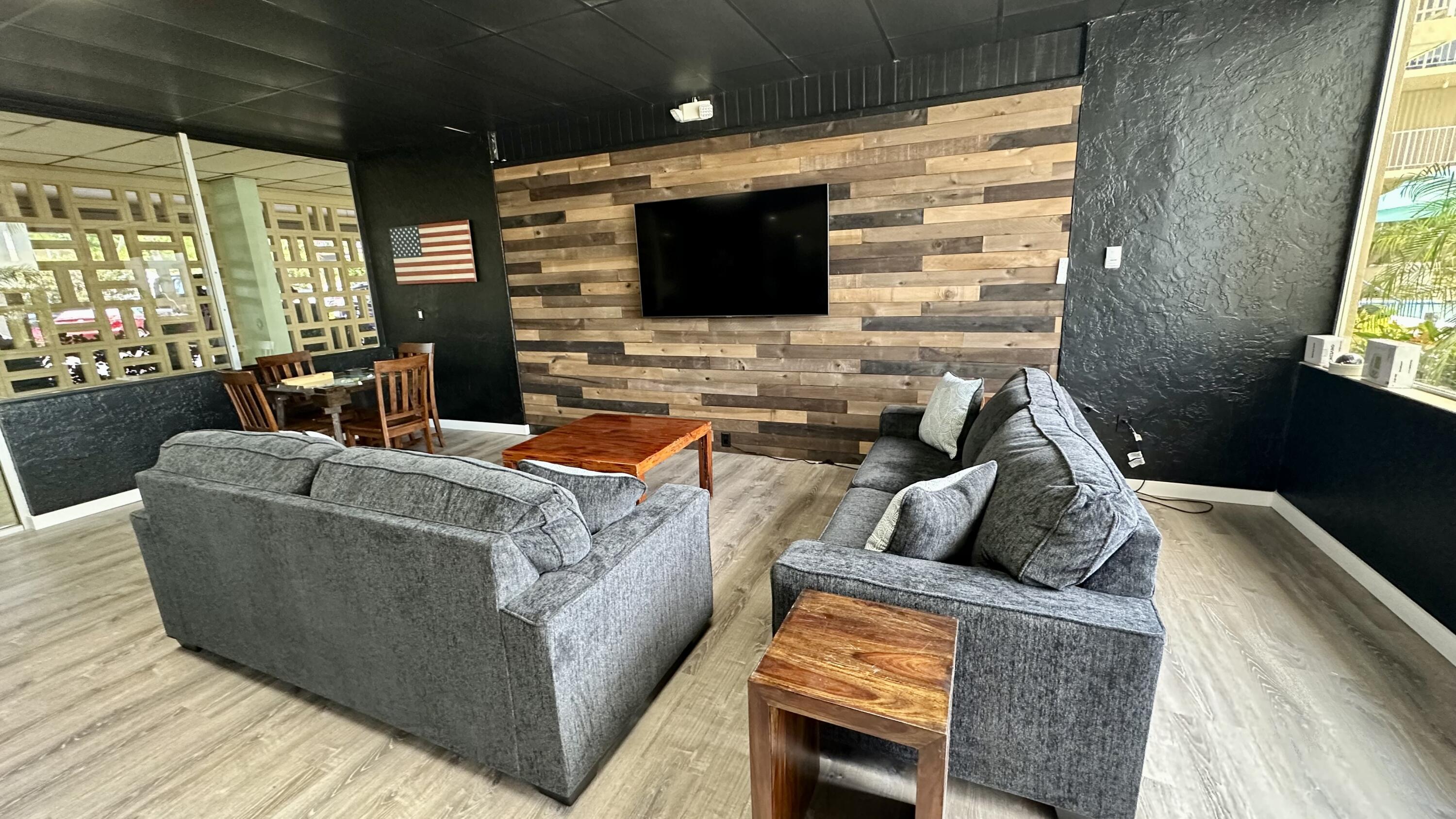 88500 Overseas Highway, Unit 413 Islamorada, FL 33036 - Photo 19 of 25 a living room with furniture and a flat screen tv