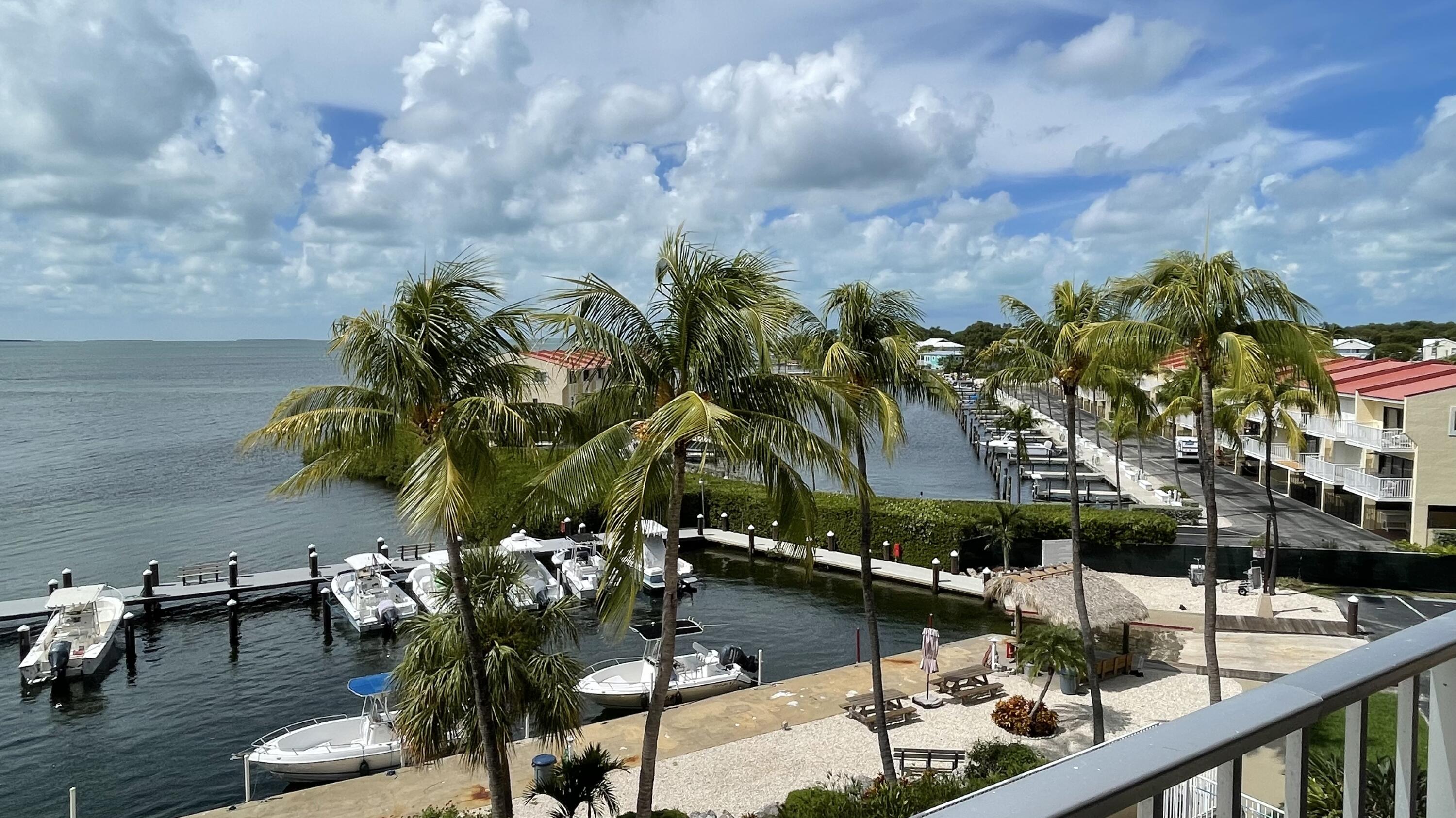 88500 Overseas Highway, Unit 413 Islamorada, FL 33036 - Photo 2 of 25 a view of swimming pool with outdoor seating