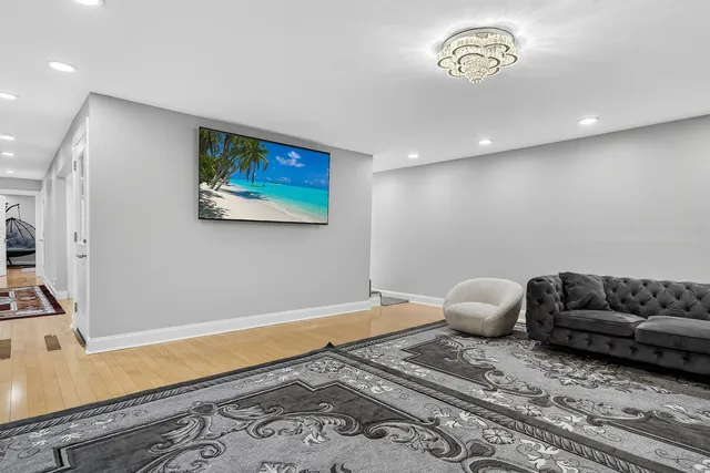 a living room with furniture and a rug