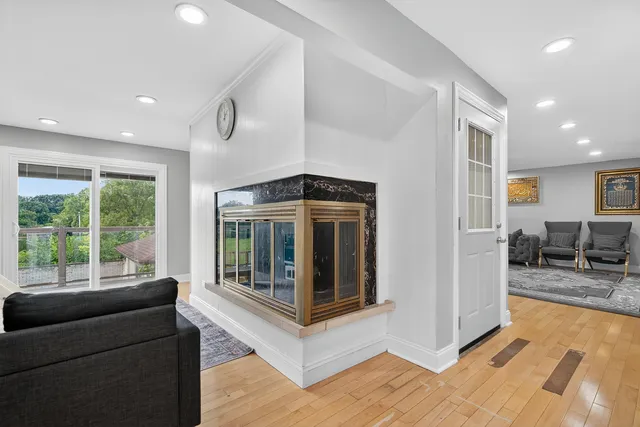 a living room with furniture and large windows