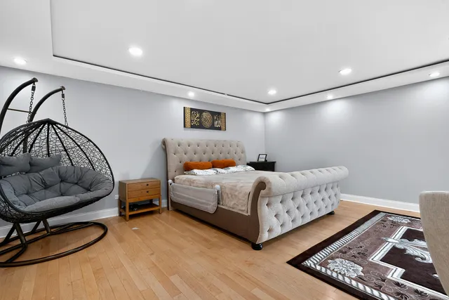 a bedroom with a bed and a couch