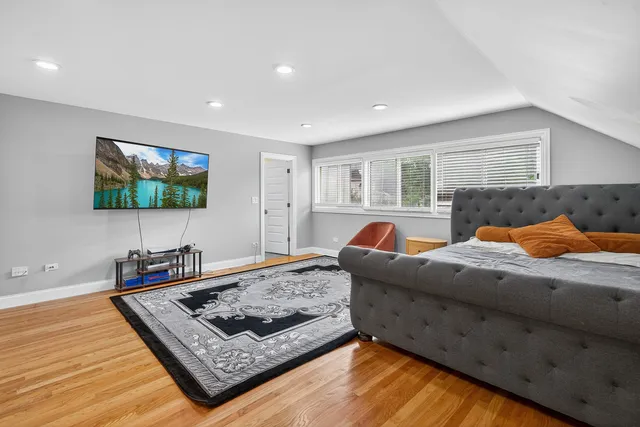 a bedroom with furniture and a window
