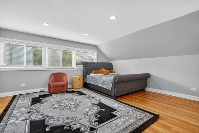 a bathroom with a shower a toilet and a sink
