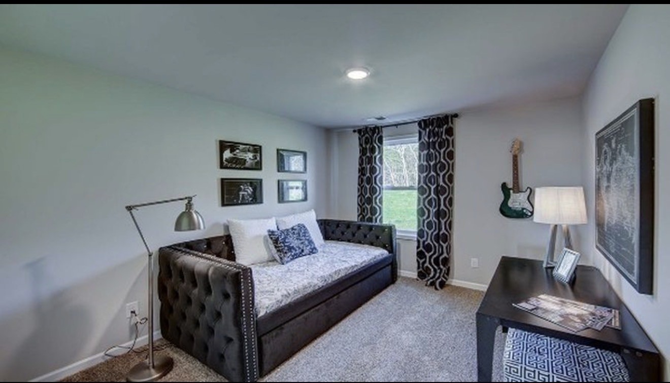 4107 Grapevine Loop Smyrna, TN 37167 - Photo 12 of 12 a living room with furniture and a flat screen tv