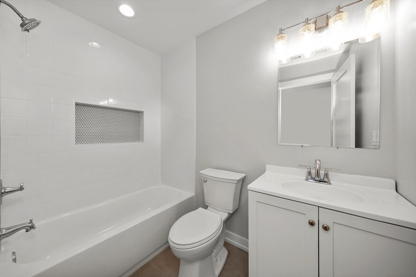 5738 South Archer Avenue Chicago, IL 60638 - Photo 13 of 16 a bathroom with a sink toilet and shower