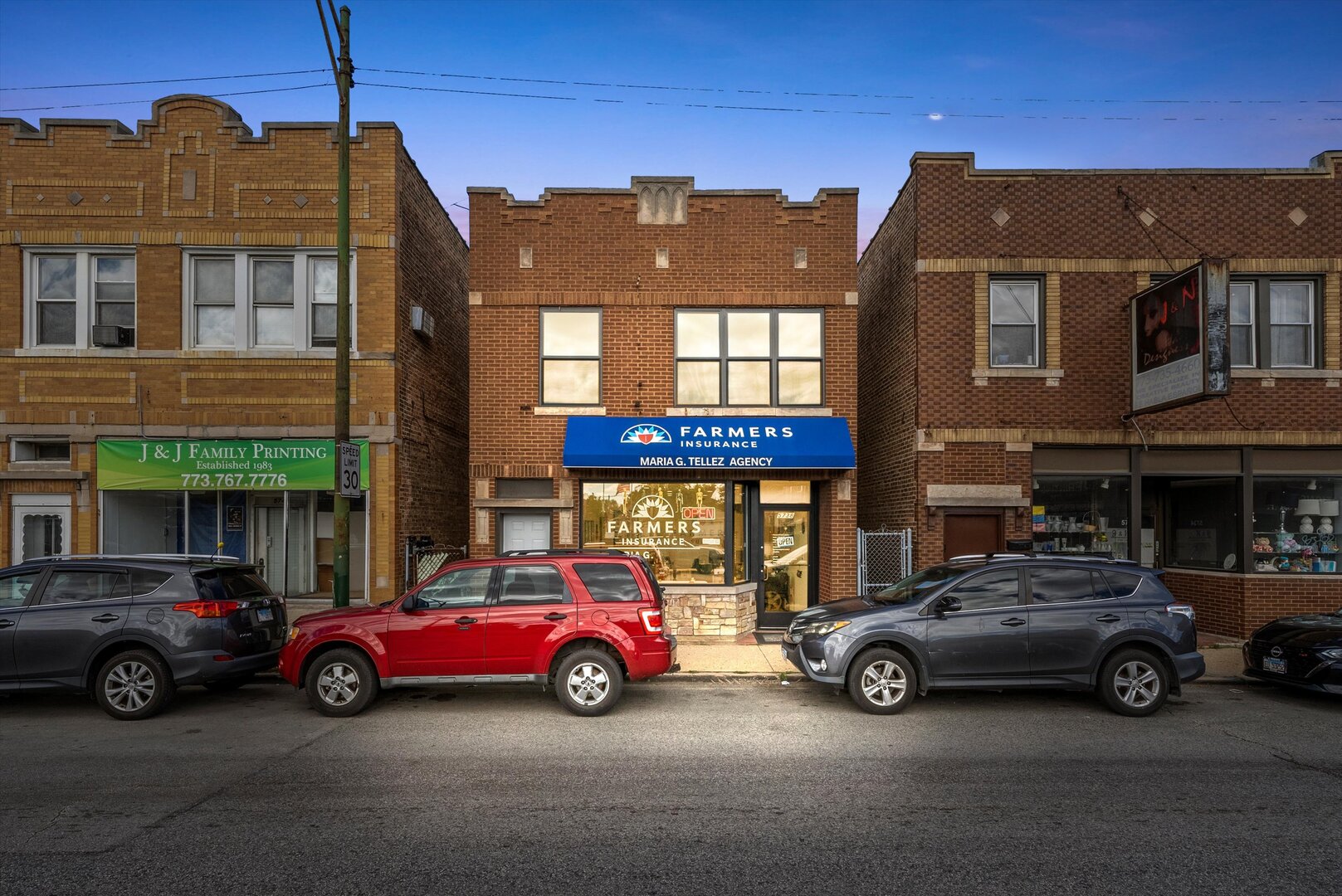 5738 South Archer Avenue Chicago, IL 60638 - Photo 2 of 16 a car parked in front of a house