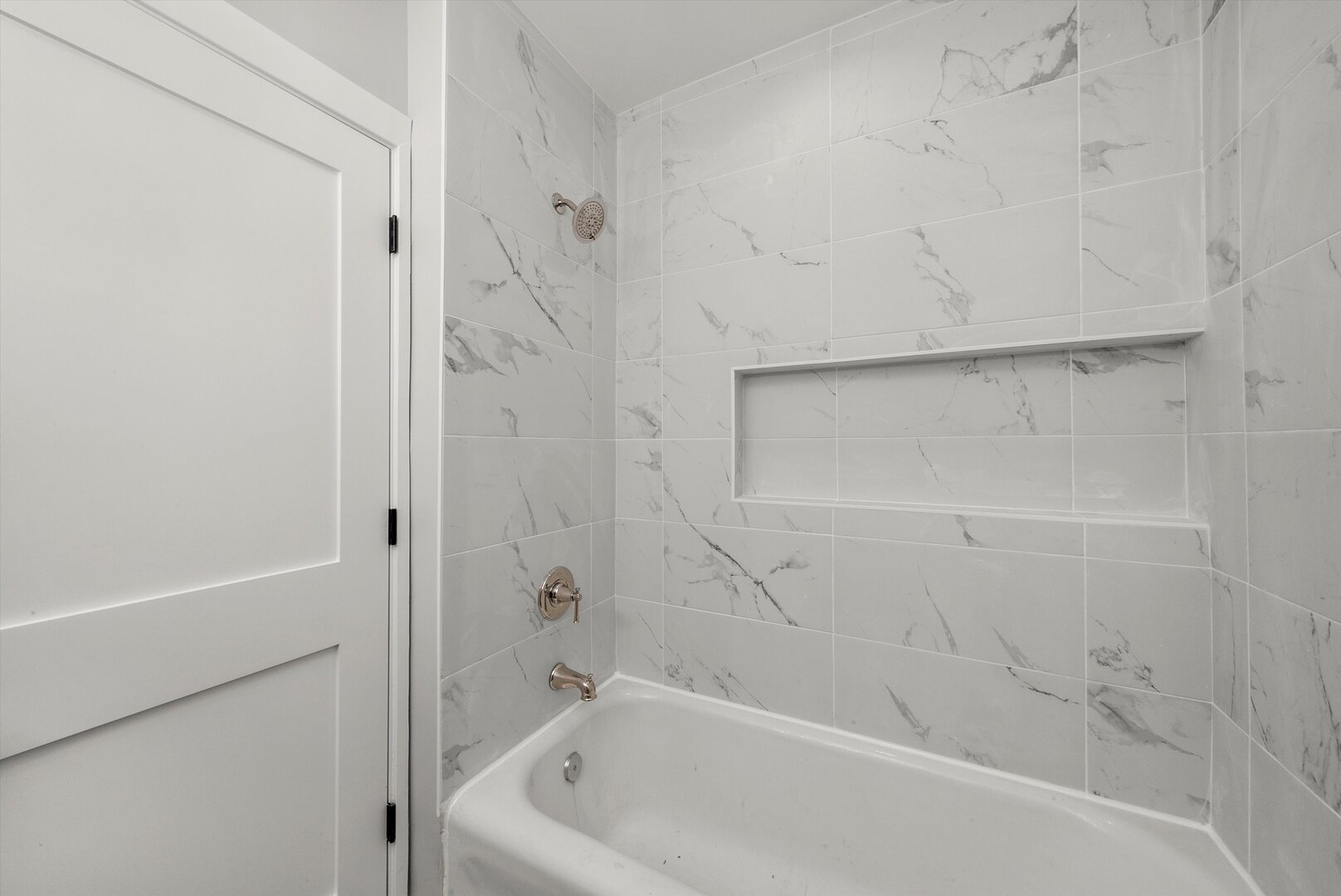 5738 South Archer Avenue Chicago, IL 60638 - Photo 7 of 16 a bathroom with a bathtub