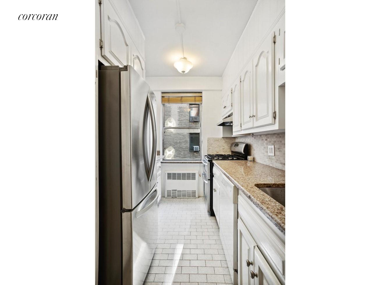 12 Beekman Place, Unit 8D Manhattan, NY 10022 - Photo 4 of 7 a kitchen with a sink cabinets and stainless steel appliances