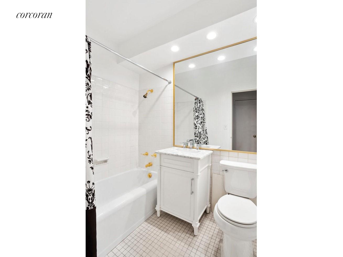 12 Beekman Place, Unit 8D Manhattan, NY 10022 - Photo 6 of 7 a bathroom with a sink toilet and shower