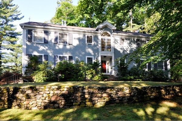 a view of house with yard and green space
