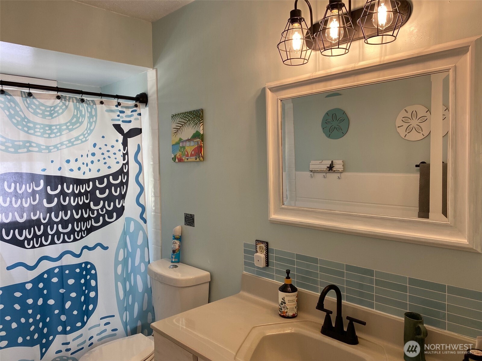 251 Elizabeth Drive Point Roberts, WA 98281 - Photo 11 of 15 a bathroom with a sink a mirror and vanity