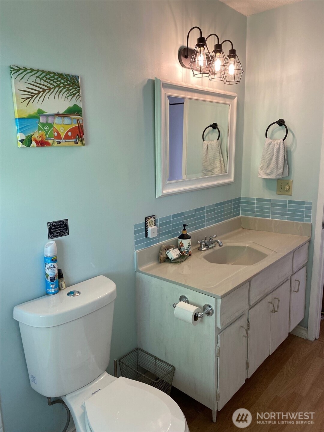 251 Elizabeth Drive Point Roberts, WA 98281 - Photo 12 of 15 a bathroom with a toilet sink and mirror