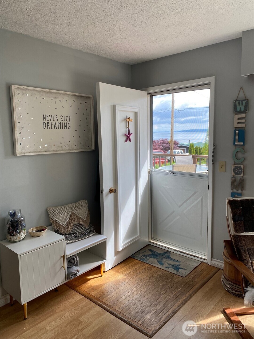 251 Elizabeth Drive Point Roberts, WA 98281 - Photo 5 of 15 a living room with a bed furniture and a large window