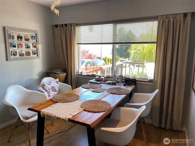 a view of a dining room with furniture window and outside view