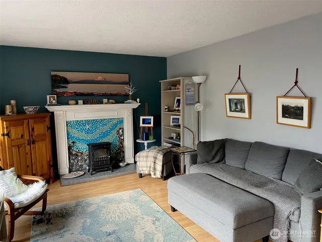 a bedroom with furniture and a fireplace