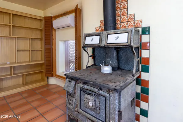 a kitchen with a stove a sink dishwasher and a refrigerator