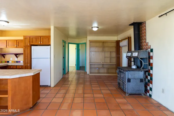 a kitchen with a sink a refrigerator and window