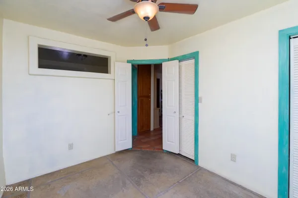 a view of a roof deck with wooden fence