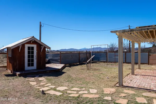 a backyard of a house with lots of trees