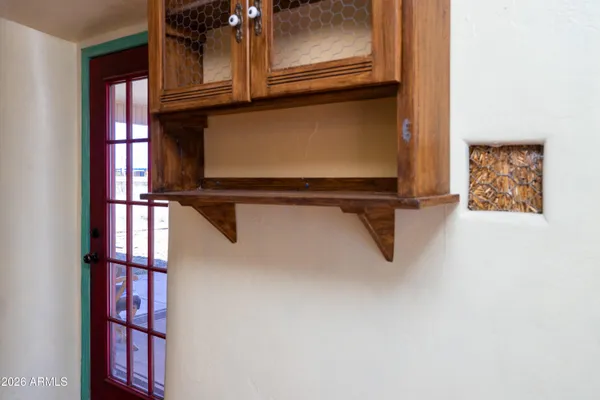 a view of a room with a window and chandelier