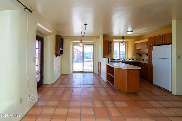 a view of kitchen island with furniture and wooden floor