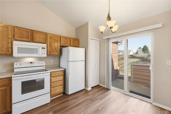 a kitchen with a refrigerator stove and a sink