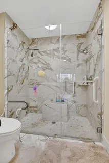 a living room with furniture potted plant and a window