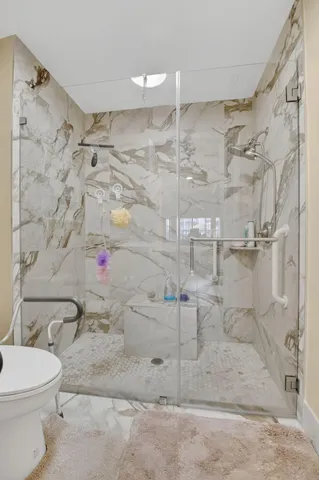 a living room with furniture potted plant and a window