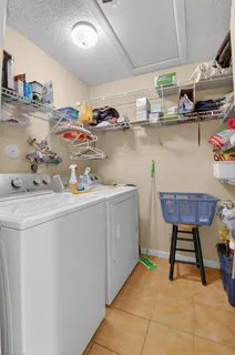 a bedroom with a bed a couch and dresser