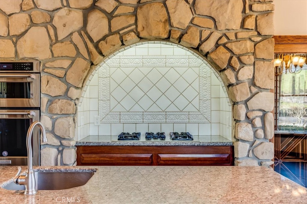 1655 Barley Grain Road Paso Robles, CA 93446 - Photo 11 of 62 Cooktop with custom tile and lighting