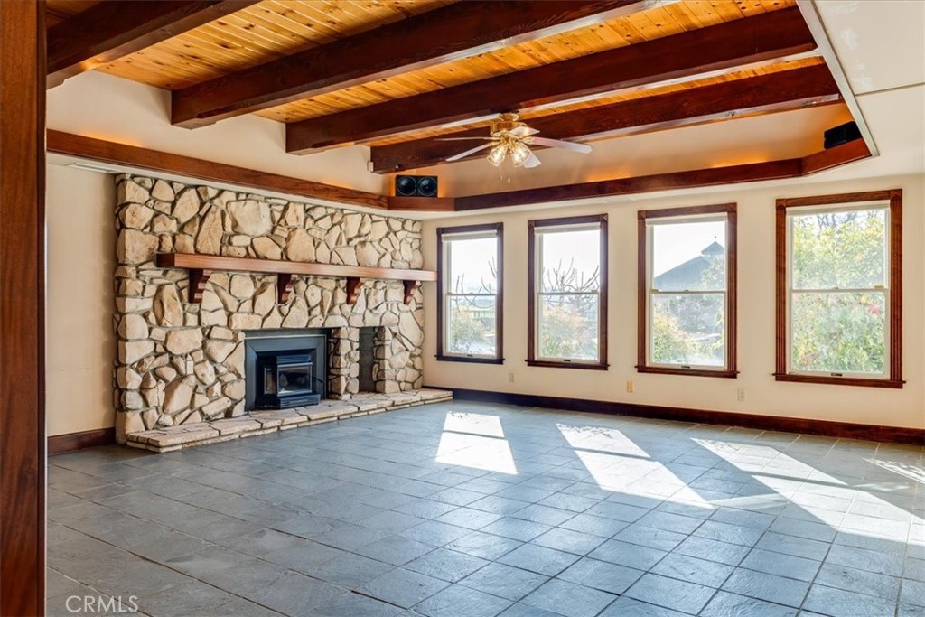 1655 Barley Grain Road Paso Robles, CA 93446 - Photo 16 of 50 Rock fireplace, Virginia slate flooring and wood ceiling comprise this beautiful family room