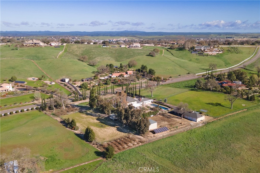 1655 Barley Grain Road Paso Robles, CA 93446 - Photo 46 of 50 The riding arena with orchards at each end. The entire property is fenced with steel pipe fencing.