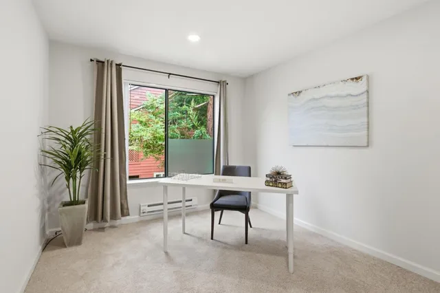 a workspace with furniture and a window