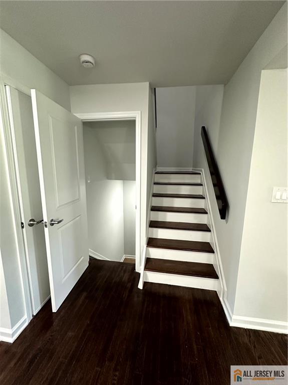 4204 Hana Road Edison, NJ 08817 - Photo 29 of 48 a view of a hallway with wooden floor and stairs