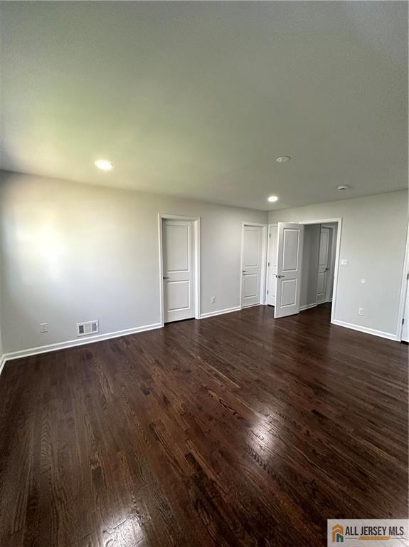 4204 Hana Road Edison, NJ 08817 - Photo 34 of 48 an empty room with wooden floor and windows