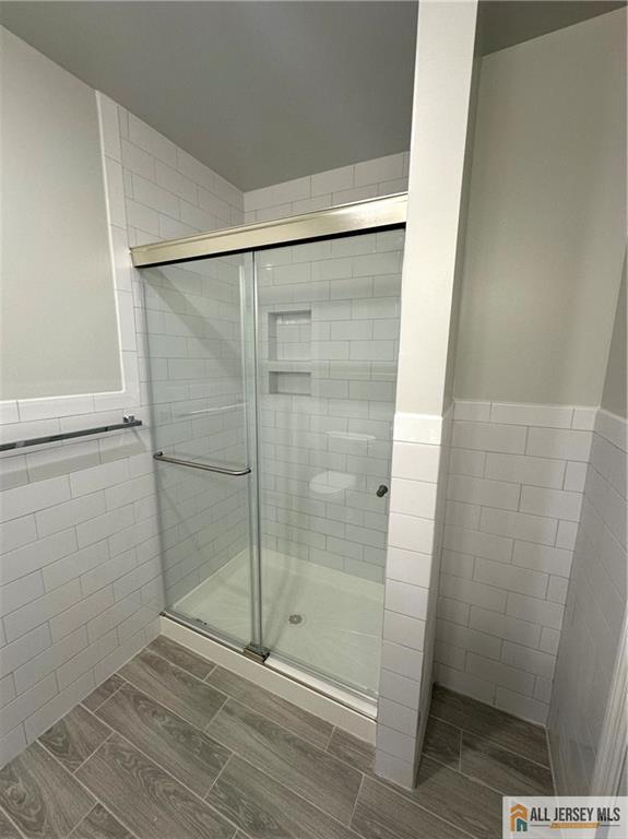 4204 Hana Road Edison, NJ 08817 - Photo 40 of 48 a bathroom with a glass door shower