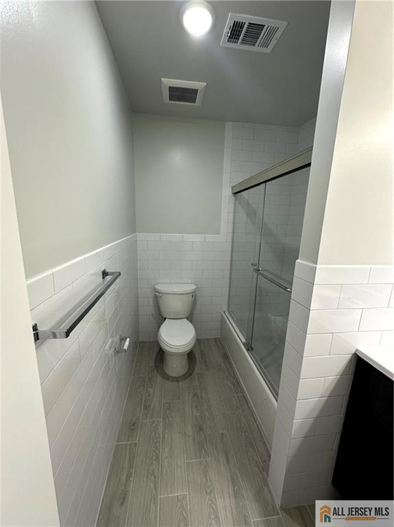 4204 Hana Road Edison, NJ 08817 - Photo 42 of 48 a bathroom with a toilet and a shower