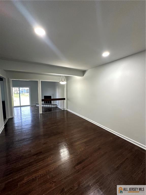 4204 Hana Road Edison, NJ 08817 - Photo 5 of 48 an empty room with wooden floor and windows
