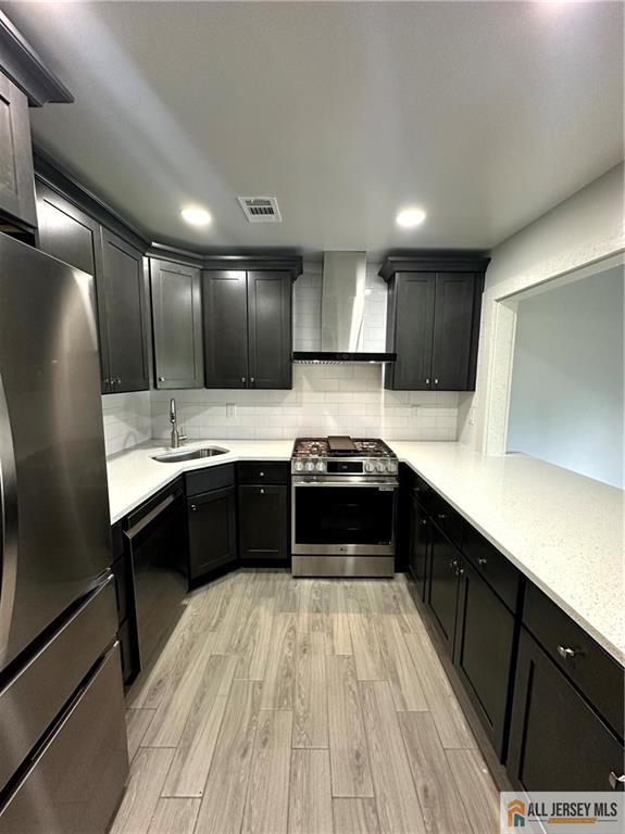 4204 Hana Road Edison, NJ 08817 - Photo 9 of 48 a large kitchen with a large counter top a sink stainless steel appliances and cabinets