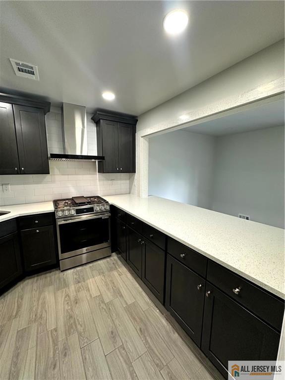 4204 Hana Road Edison, NJ 08817 - Photo 10 of 48 a large kitchen with a large counter top stainless steel appliances and cabinets