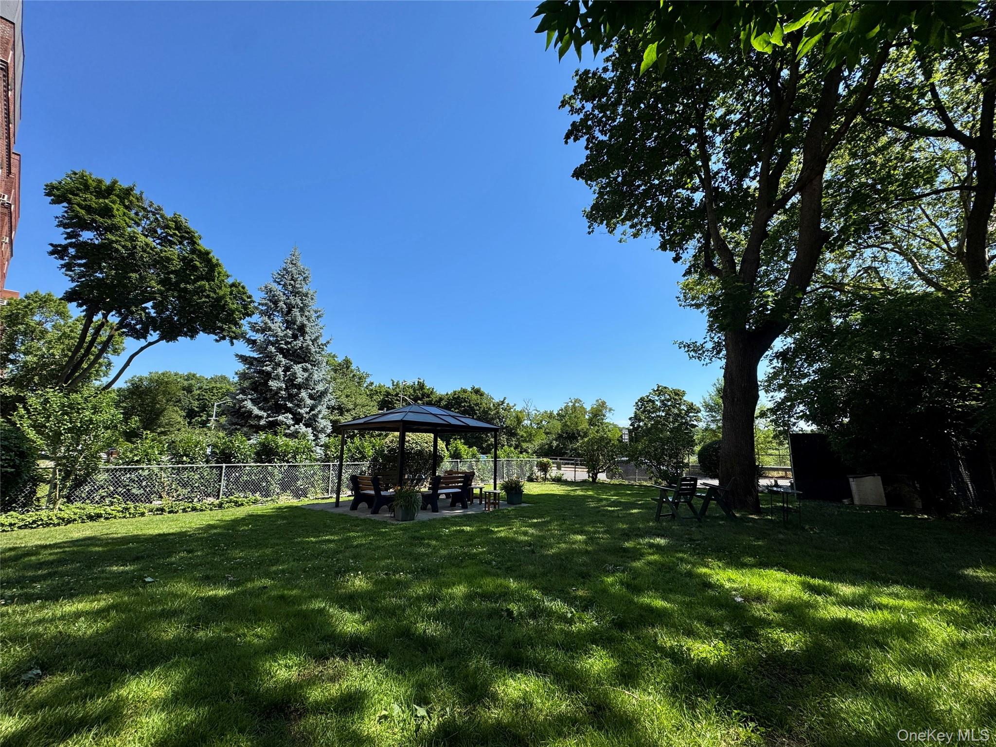113-14 72nd Road, Unit 1M Queens, NY 11375 - Photo 18 of 20 a view of a park with large trees