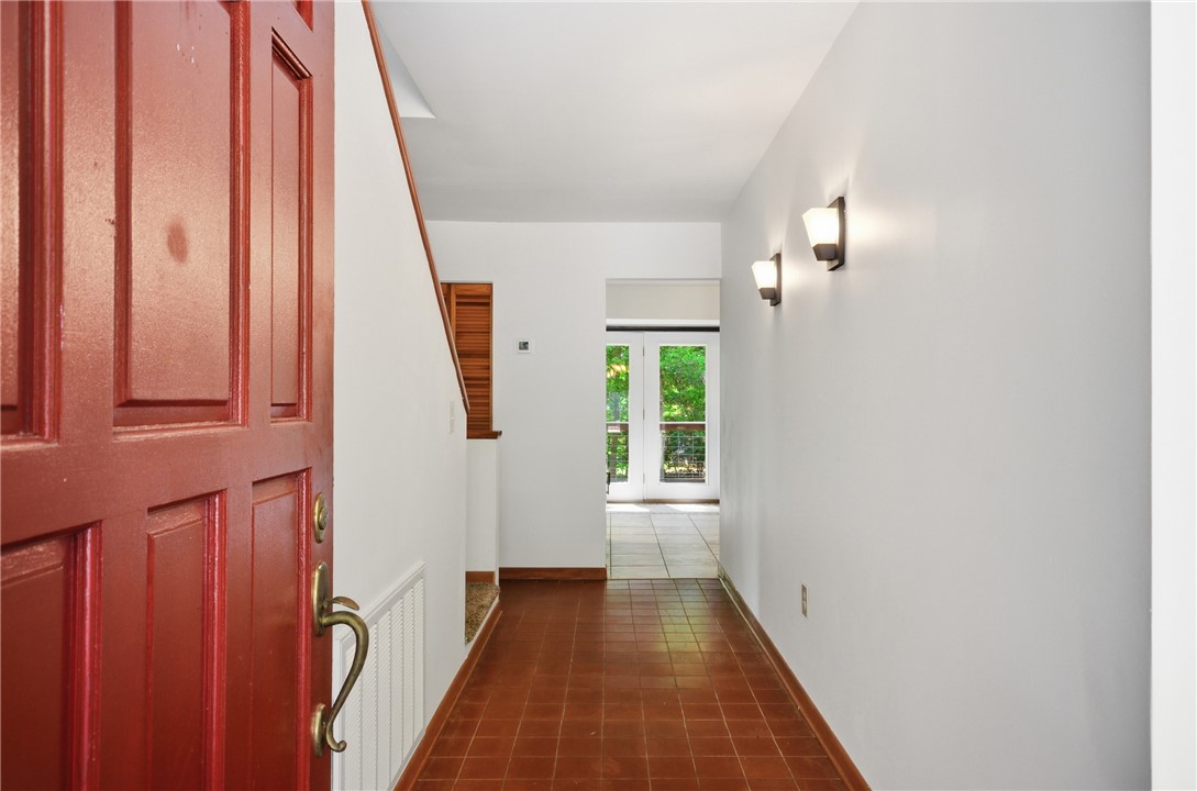 1298 Carradine Road Seneca, SC 29678 - Photo 10 of 43 A welcoming entryway with tile flooring leads to French doors opening to outdoor greenery.