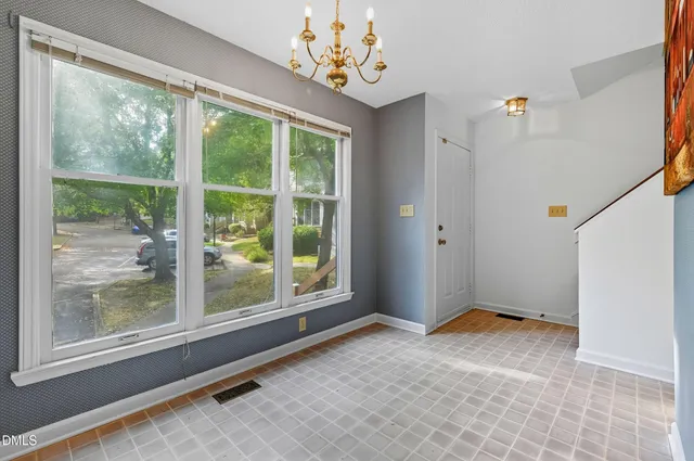 a kitchen with a stove a sink and a microwave