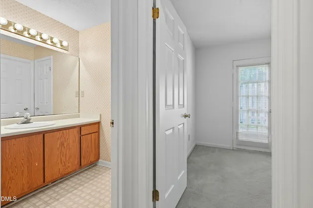 a view of an empty room with a window