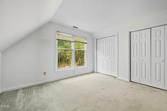 a view of a hallway with a white walls