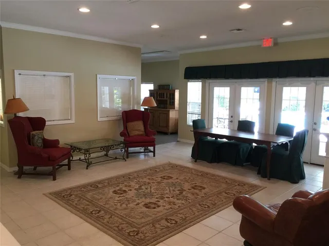 a living room with furniture rug and window