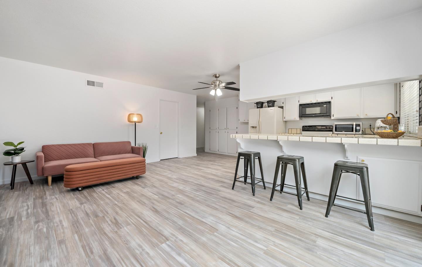 929 Maclay Drive San Jose, CA 95123 - Photo 11 of 23 a living room with stainless steel appliances furniture and wooden floor