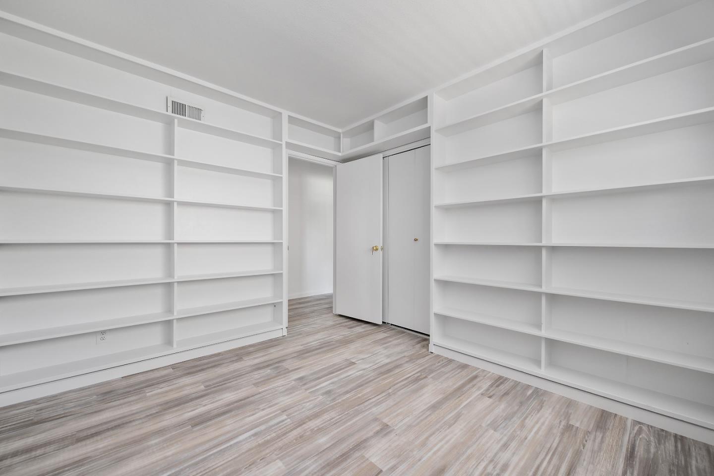929 Maclay Drive San Jose, CA 95123 - Photo 13 of 23 a view of a room with walk in closet and wooden floor