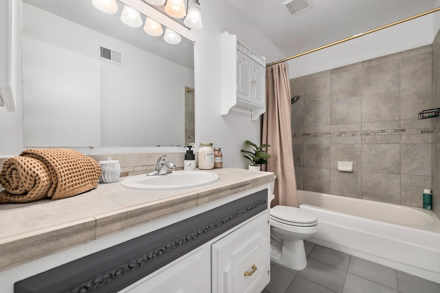 929 Maclay Drive San Jose, CA 95123 - Photo 14 of 23 a bathroom with a double vanity sink toilet mirror and shower
